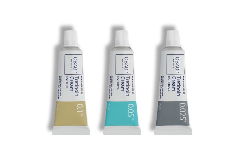 Three tubes of Obagi Tretinoin Cream for acne and anti-aging in 0.1%, 0.05%, and 0.025%.