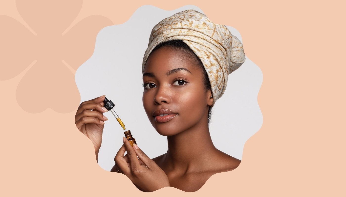 Woman with a headwrap applies facial oil, highlighting her nighttime skincare routine.