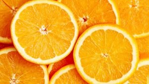 Close-up of orange slices showing juicy pulp, bright color, and rich Vitamin C content.