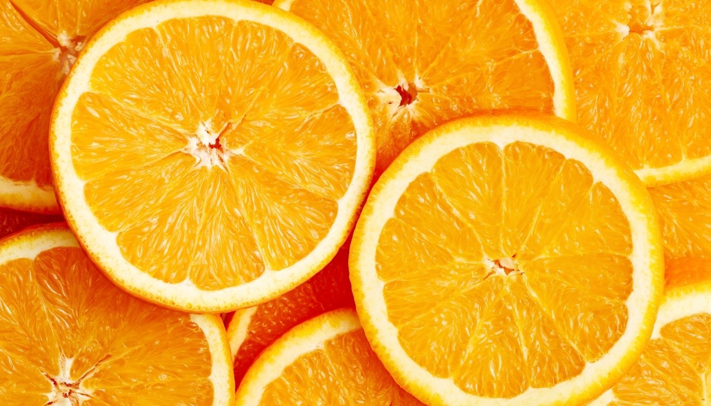 Close-up of orange slices showing juicy pulp, bright color, and rich Vitamin C content.