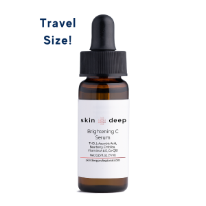 Small amber dropper bottle labeled Skin Deep Brightening C Serum with Travel Size! text.