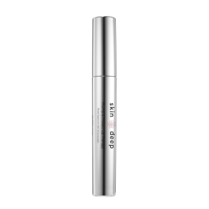 Silver tube labeled skin deep, standing upright on a plain white background.