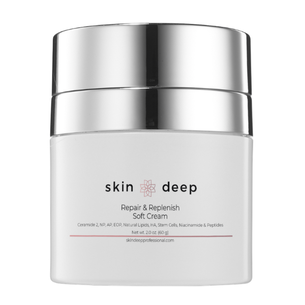White and silver jar labeled skin deep Repair & Replenish Soft Cream on a plain background.