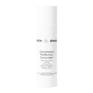 White bottle of Skin Deep Complexion Perfection Sunscreen SPF 50 on a plain background.