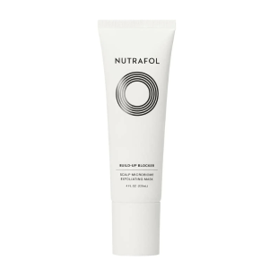 White tube labeled Nutrafol Build-Up Blocker Scalp Microbiome Exfoliating Mask.