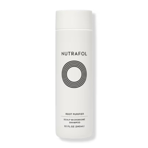 White Nutrafol Root Purifier shampoo bottle with text that says Scalp Microbiome Shampoo